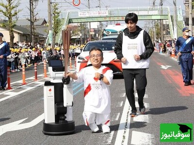 (ویدیو) تکنولوژی به میدان المپیک آمد/ کمک‌رسانی ربات به انسان برای حمل مشعل المپیک