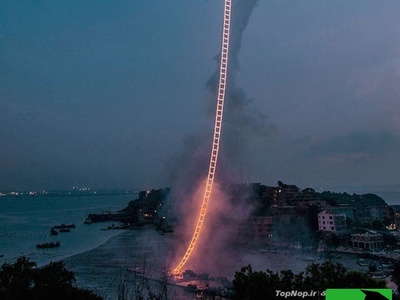 معجزه خلاقیت یک هنرمند چینی برای اختراع «نردبان آتشین» زمین و آسمان را به هم دوخت! شبی که آسمان آتش گرفت+فیلم