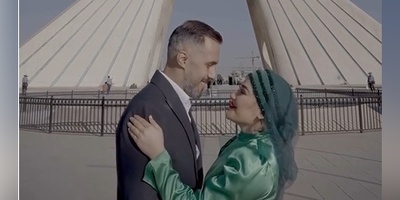 ابتکار منحصربفرد یک زوج در ضبط کلیپ فرمالیته عروسی‌شان در میدان آزادی؛ از لباس عروسی به شکل پرچم ایران تا نقشه ایران به جای دسته گل در دستان عروس+فیلم